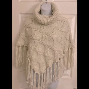 Elegant Cream Knit Poncho with Fringe
